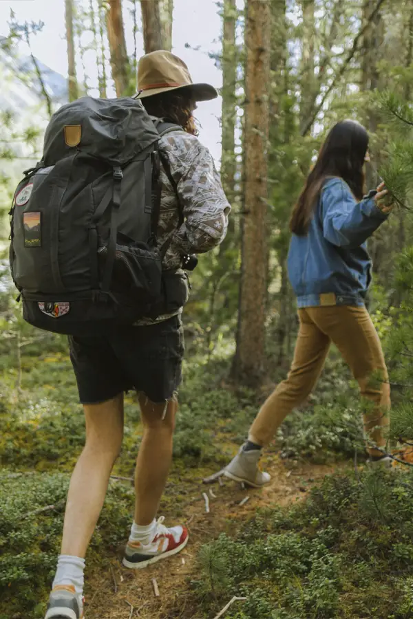 couple of women hiking in woods